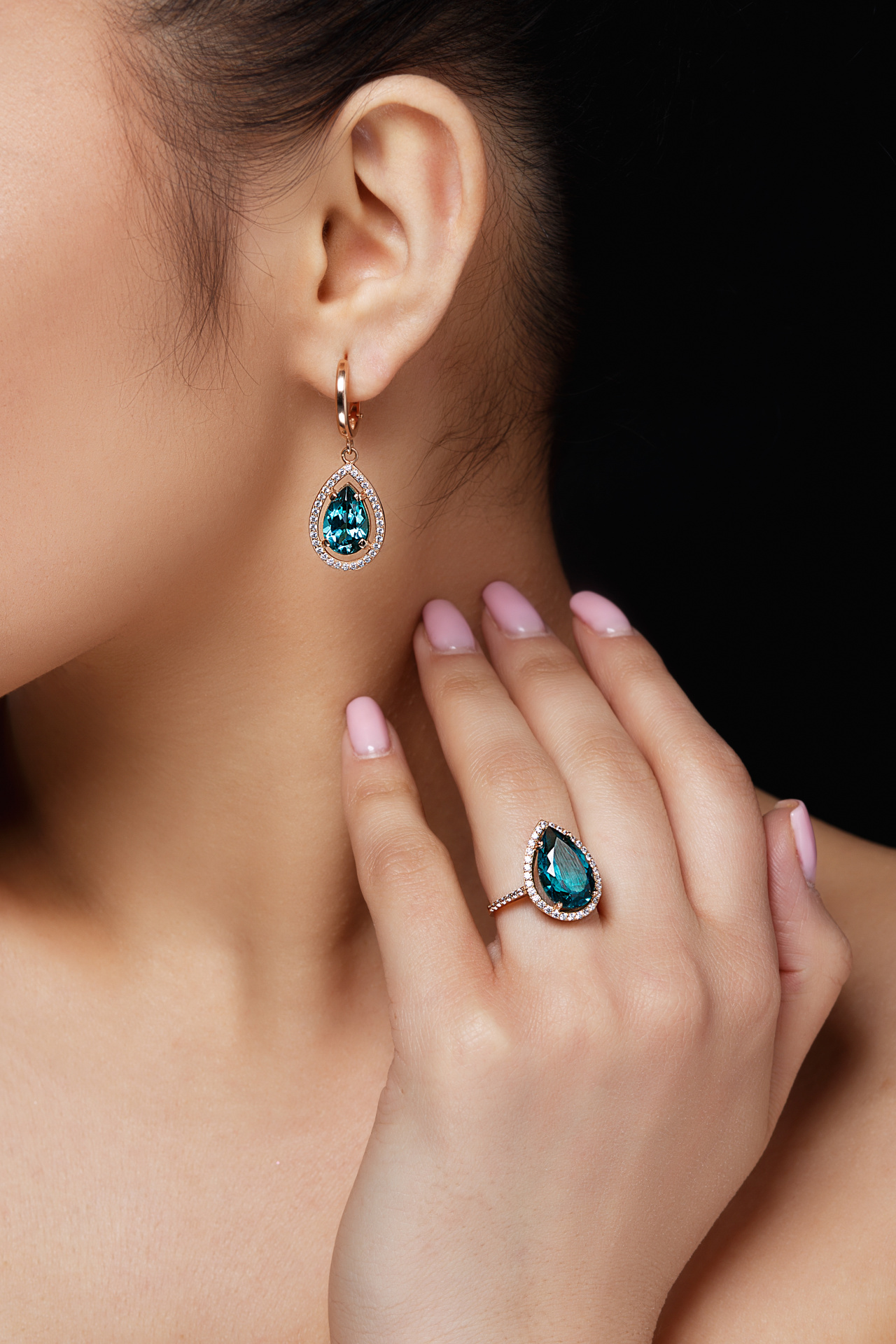 model-shows-earrings-ring-with-beautiful-blue-precious-stones.jpg